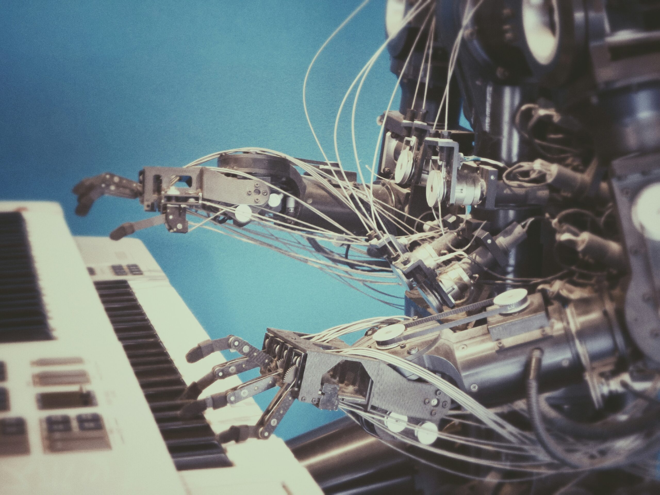 A robot playing the piano, representing the balance between the science of data and the art of insights.