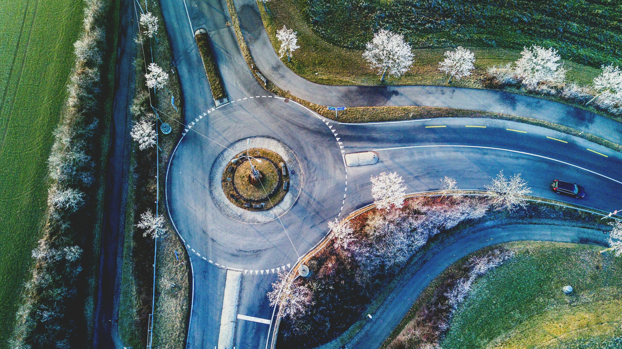 Bird’s-eye view of a roundabout, symbolizing the process of exploring multiple paths to uncover deeper insights.