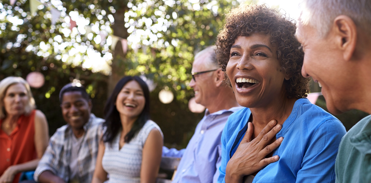 A diverse group of people have a fun and casual discussion.
